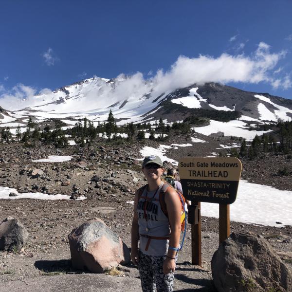 Graduate student Kelsey Prissel poses during fieldwork at Mount Shasta.