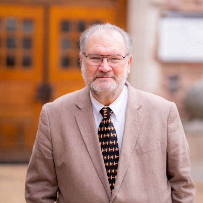 Headshot of ​Robert F. Dymek