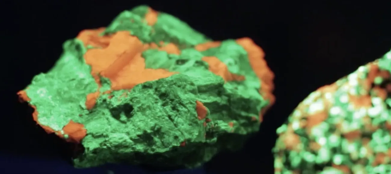 glowing green and orange rocks