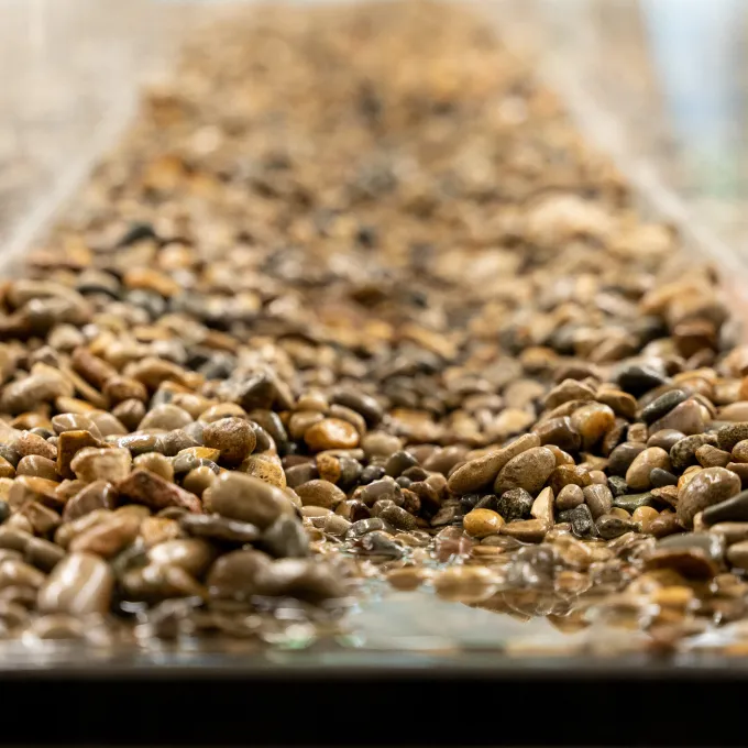 Masteller's flume models the erosion patterns of gravel bed rivers 