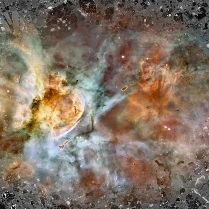 The Carina nebula, where newborn stars are irradiated by intense ultraviolet light from nearby massive stars - possibly similar to the environment which birthed our solar system - is pictured over a fragment of Acfer 094. (Credit: Ryan Ogliore)